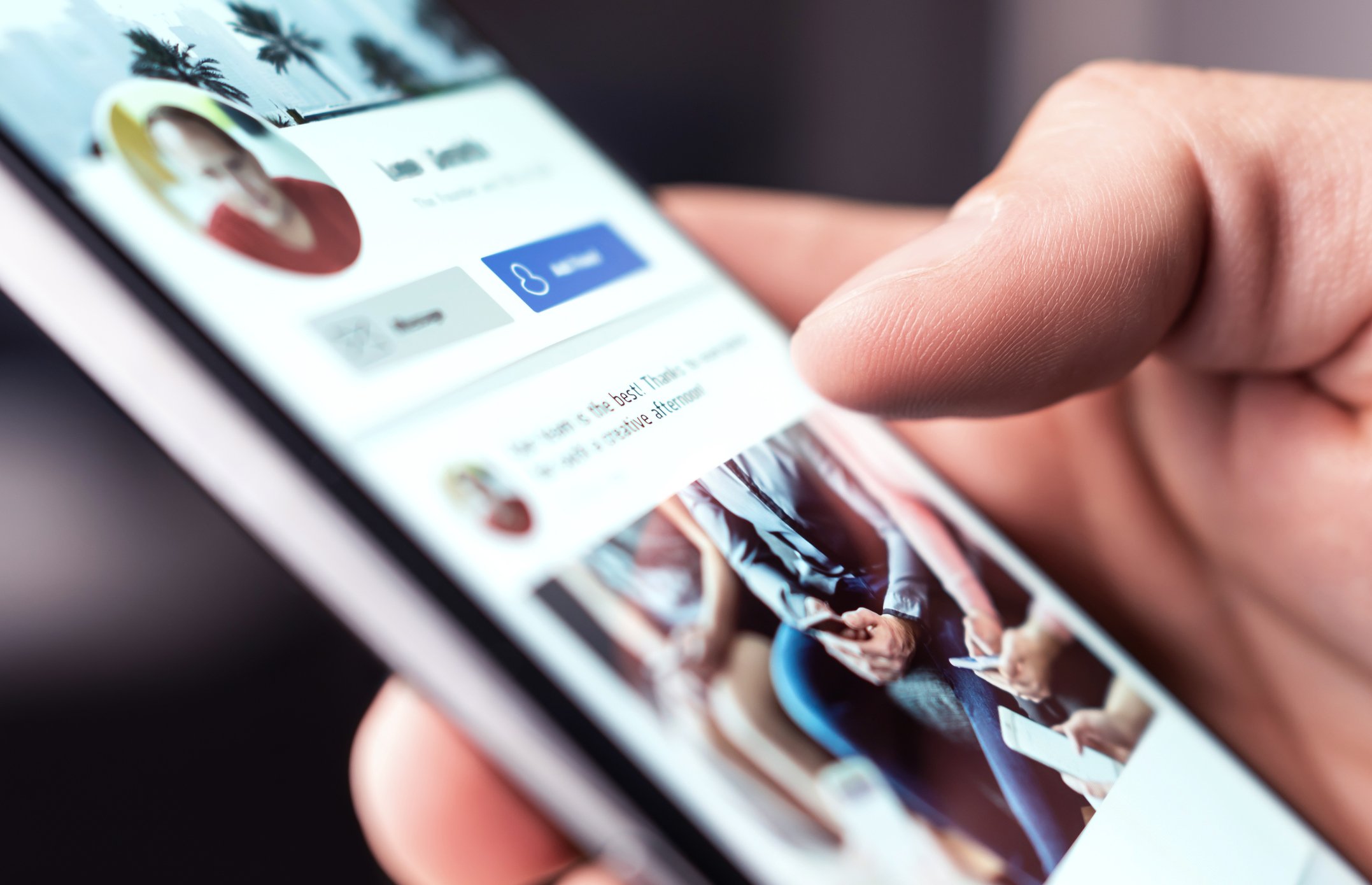 Person using social media on mobile phone by Getty Images